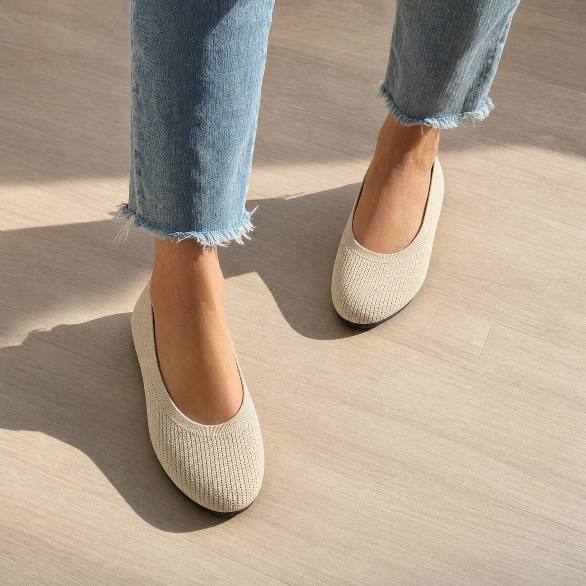 Woman wearing beige knit slip-on flats, lifestyle
