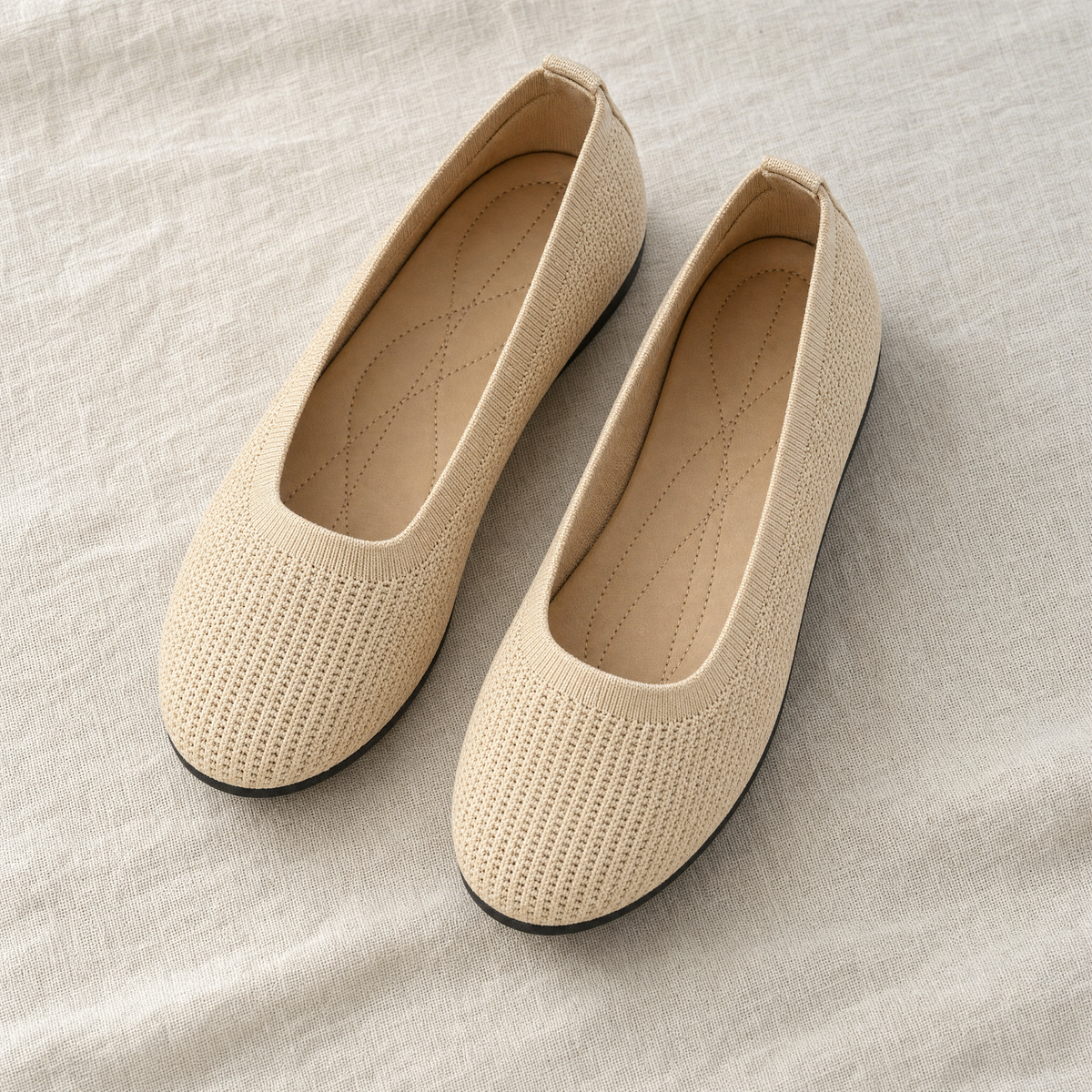 Beige knit slip-on flats, flatlay