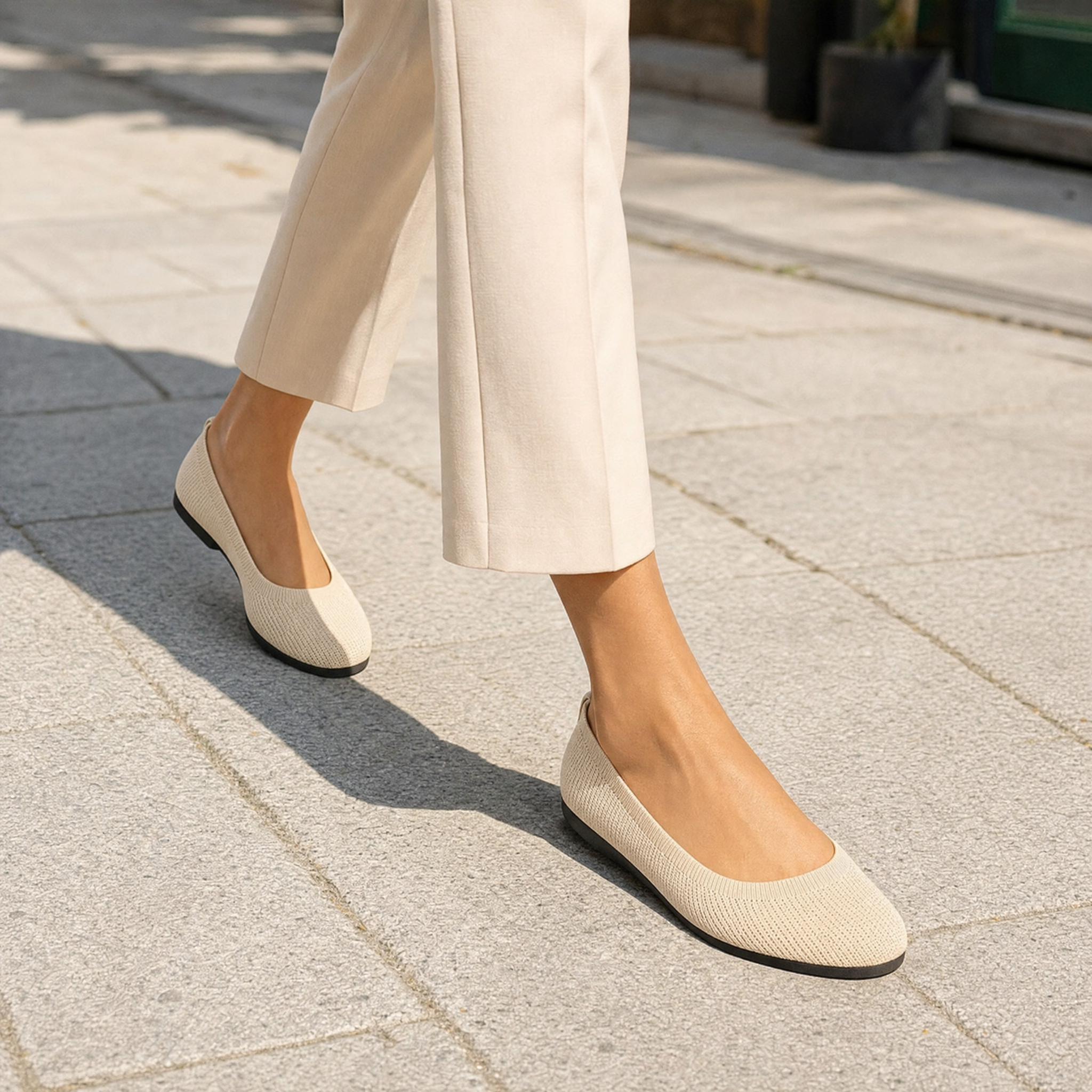 Woman wearing beige knit slip-on shoes, lifestyle