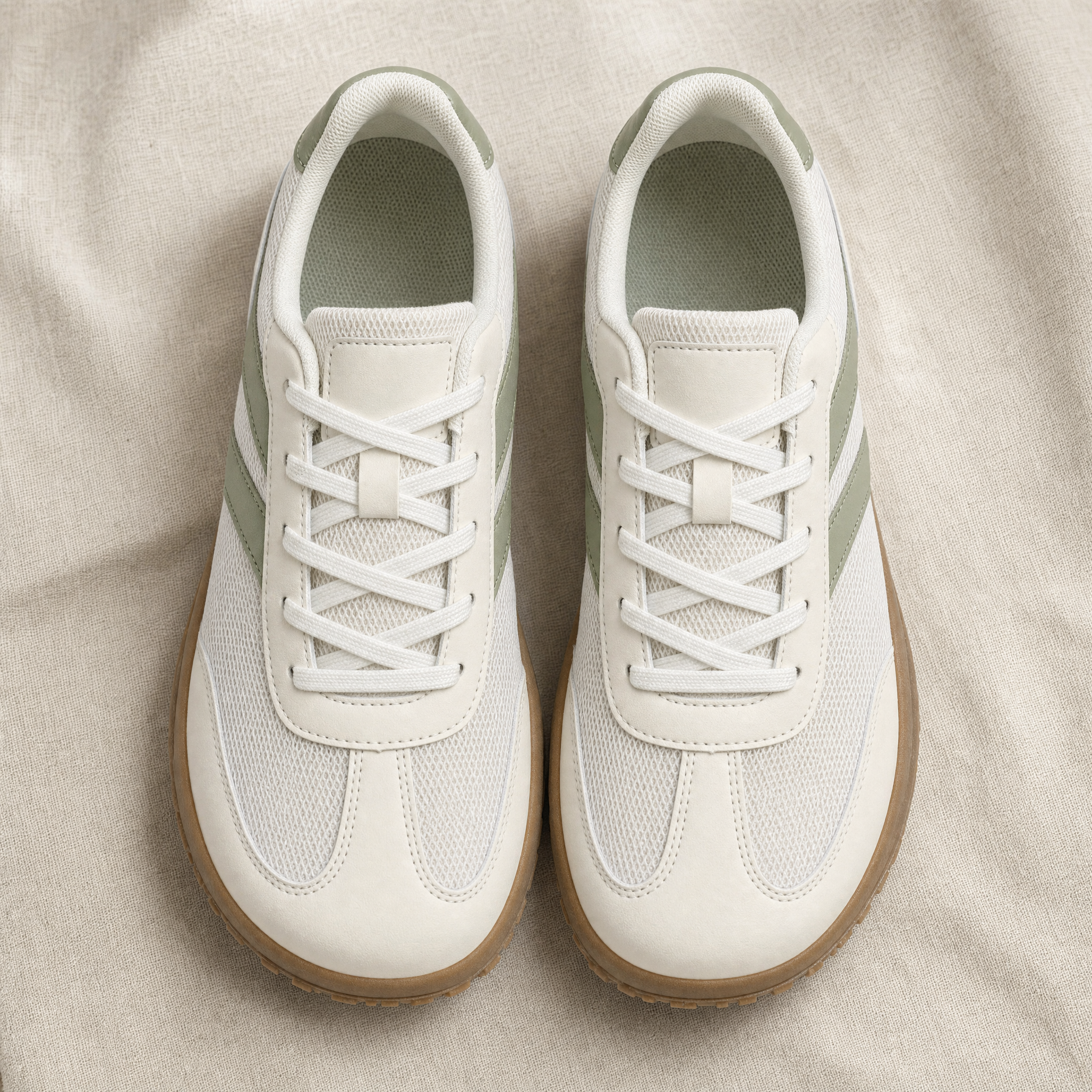 Cream and sage green wide-toe-box barefoot sneakers, flatlay
