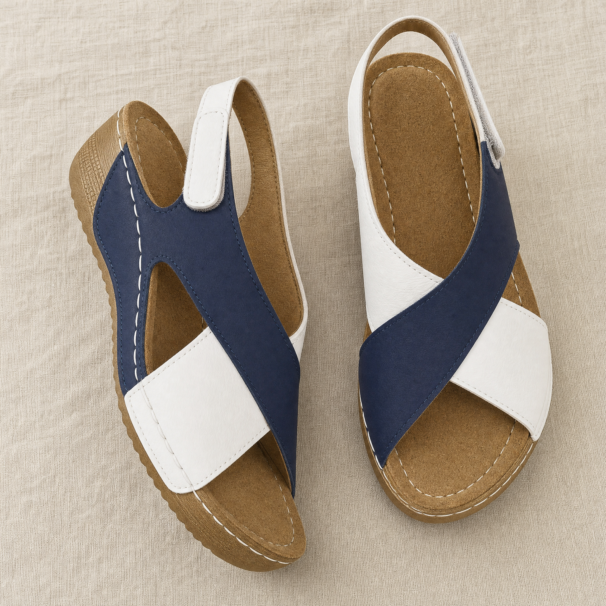 White and navy color-block wedge sandals, flatlay
