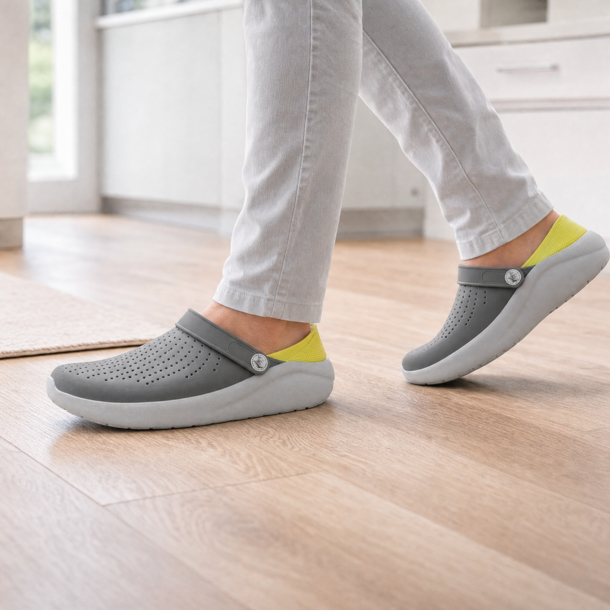 Woman wearing two-tone grey cushioned clogs, lifestyle