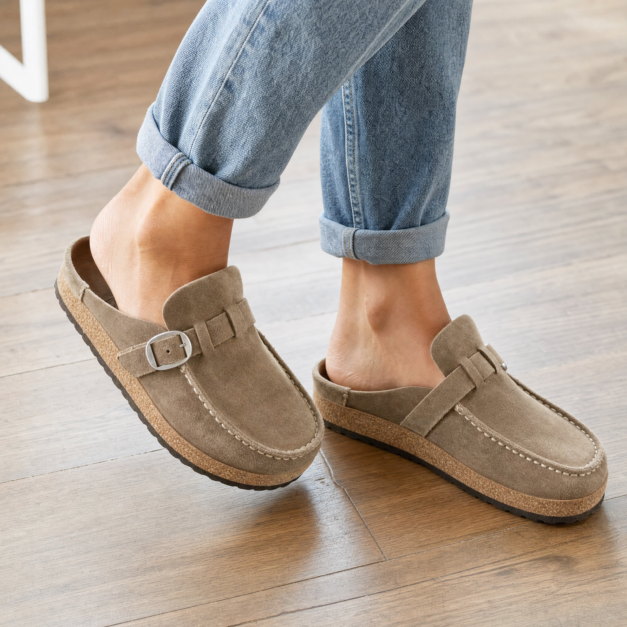 Woman wearing taupe suede clog mules, lifestyle